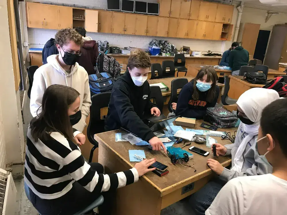 Anna, Koby, Jacob, Grace and Retaj working on the 2022 CETA line following robot